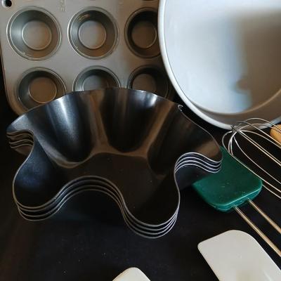 Baking pans - flour sifter - Measuring cups - cooling racks -whisk and more for baking