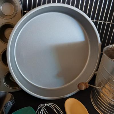 Baking pans - flour sifter - Measuring cups - cooling racks -whisk and more for baking