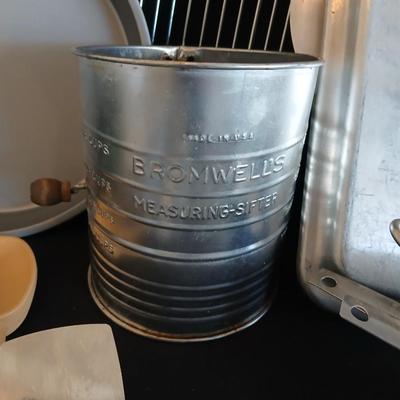 Baking pans - flour sifter - Measuring cups - cooling racks -whisk and more for baking