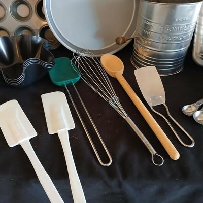 Baking pans - flour sifter - Measuring cups - cooling racks -whisk and more for baking