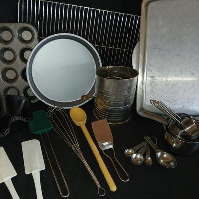 Baking pans - flour sifter - Measuring cups - cooling racks -whisk and more for baking