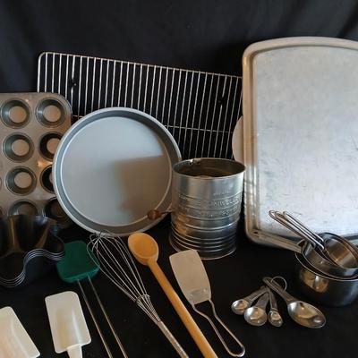 Baking pans - flour sifter - Measuring cups - cooling racks -whisk and more for baking