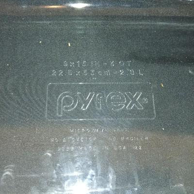 Glass Pyrex baking dishes glass mixing bowl and a cooling rack