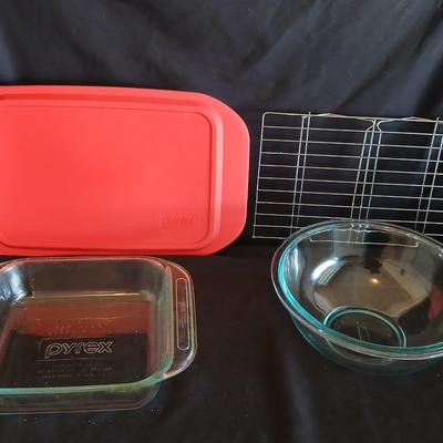 Glass Pyrex baking dishes glass mixing bowl and a cooling rack