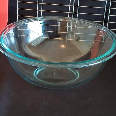 Glass Pyrex baking dishes glass mixing bowl and a cooling rack