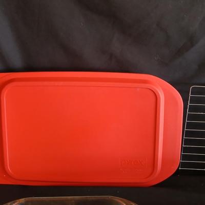 Glass Pyrex baking dishes glass mixing bowl and a cooling rack