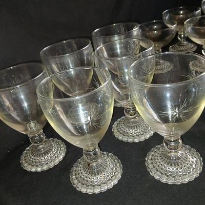 Twelve matching Bubble footed glasses with etched starburst design