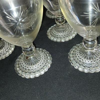 Twelve matching Bubble footed glasses with etched starburst design