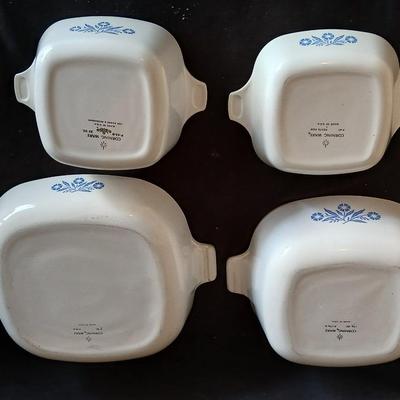 Four Corning ware dishes two with lids