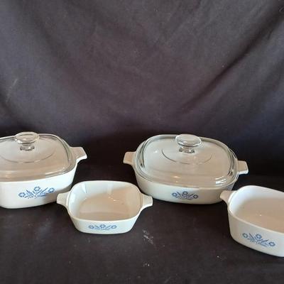 Four Corning ware dishes two with lids