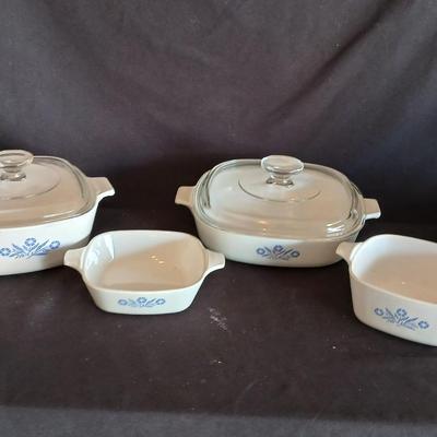 Four Corning ware dishes two with lids