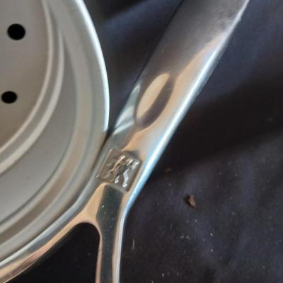 Variety of cooking pans and saucepans with silicone server and hot pads