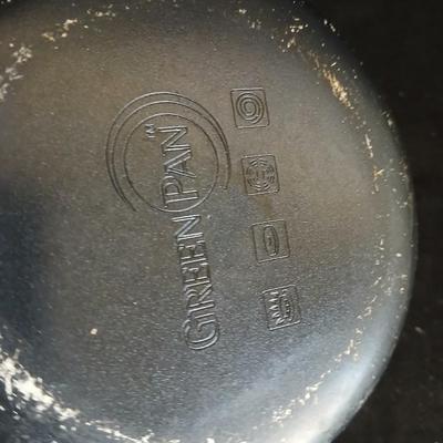 Variety of cooking pans and saucepans with silicone server and hot pads
