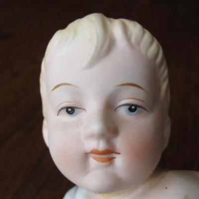Antique bisque porcelain piano baby