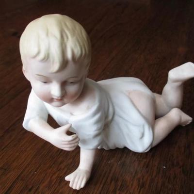 Antique bisque porcelain piano baby