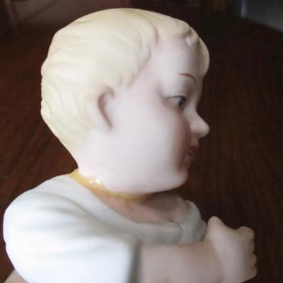 Antique bisque porcelain piano baby