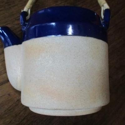 Vintage cobalt blue stoneware teapot with rattan handle