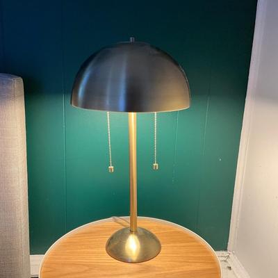 Sale Photo Thumbnail #57: With a stylish dome shade, two lights that can easily be turned off and on and a warm brass finish, the Novogratz x Globe Haydel Table Lamp
21" high x 11" diameter shade