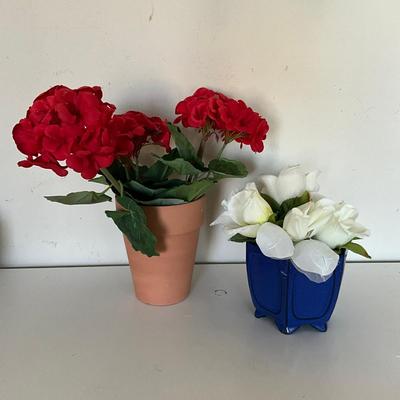 325 Red Flower Arrangement In Clay Pot With Yellow Flowers In Blue Vase