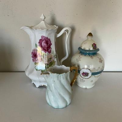 Sale Photo Thumbnail #1130: Lot includes: Lidded Sugar Bowl and Cream Pitcher