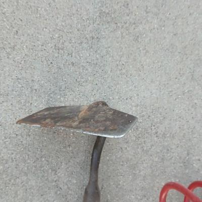 An older harrowing tool, a hoe and a cultivator