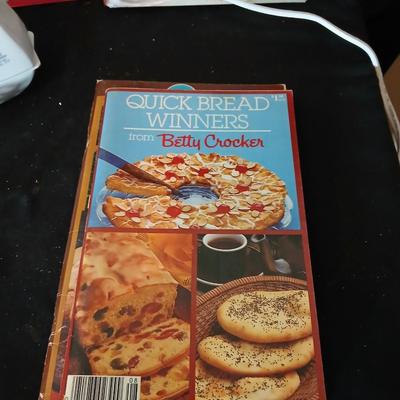 Baking pans, with large glass mixing bowl, cooling rack, and Kitchen Gourmet electric mixer