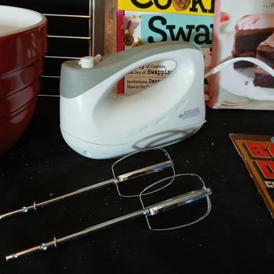 Baking pans, with large glass mixing bowl, cooling rack, and Kitchen Gourmet electric mixer