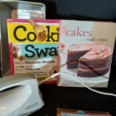 Baking pans, with large glass mixing bowl, cooling rack, and Kitchen Gourmet electric mixer