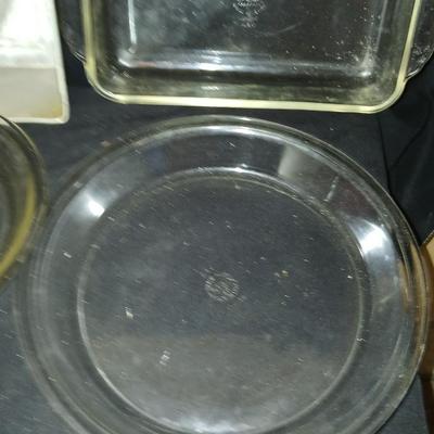 Baking pans, with large glass mixing bowl, cooling rack, and Kitchen Gourmet electric mixer