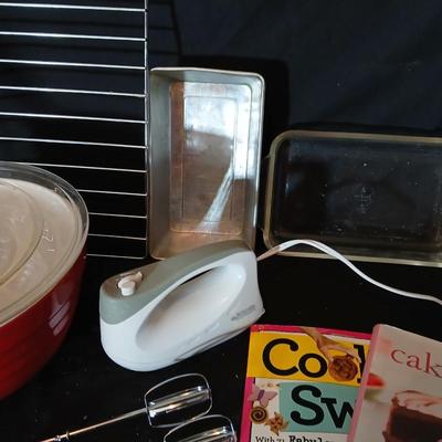 Baking pans, with large glass mixing bowl, cooling rack, and Kitchen Gourmet electric mixer
