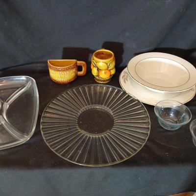 A half cup of coffee mug, divided glass tray, large bowl with plate, glass platter and more