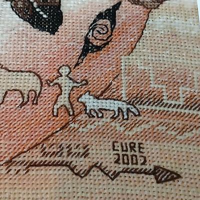 Two framed wall art - Windmill by Jessi Scott - and a cross stitch of Tribal Ponies