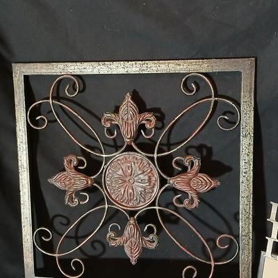 Square metal wall art and a Live Laugh Love photo frame