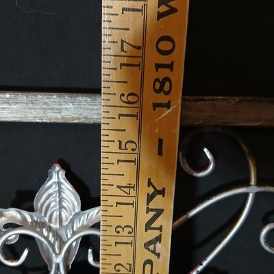 Square metal wall art and a Live Laugh Love photo frame
