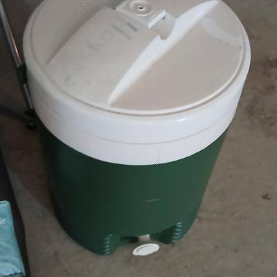 Mesh folding camp chair with carry bag and a green igloo drink cooler