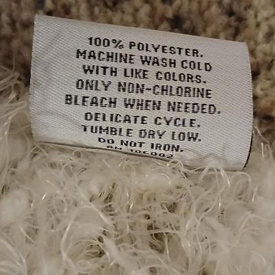 Two throw pillows and a Bella Lux Fine Linen light weight blanket