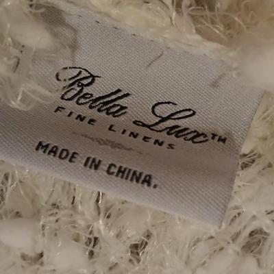 Two throw pillows and a Bella Lux Fine Linen light weight blanket