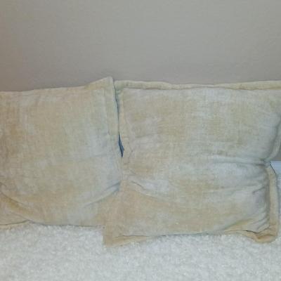 Two throw pillows and a Bella Lux Fine Linen light weight blanket