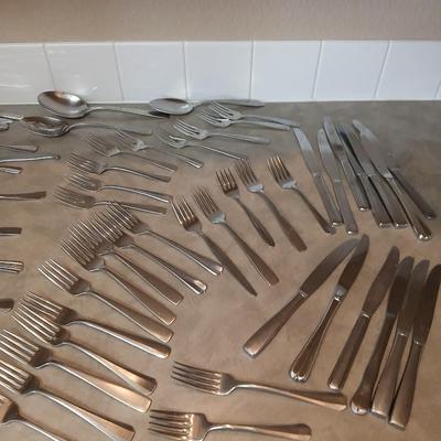 Lots of mismatched flatware - spoons - forks - knives and serving flatware