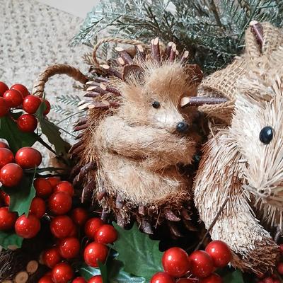 Christmas wreath with basket of holly, and pine with adorable porcupines
