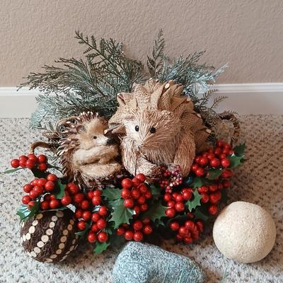 Christmas wreath with basket of holly, and pine with adorable porcupines