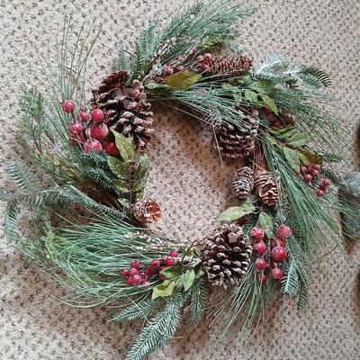 Christmas wreath with basket of holly, and pine with adorable porcupines