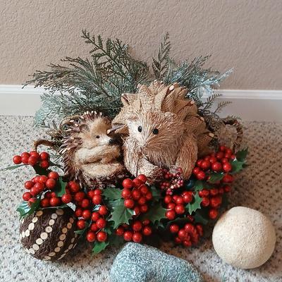 Christmas wreath with basket of holly, and pine with adorable porcupines