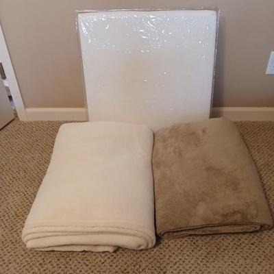 Two queen size blankets and a wedge pillow