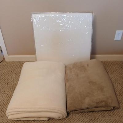 Two queen size blankets and a wedge pillow