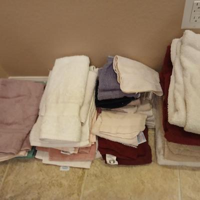 Assortment of mismatched bath towels - washcloths - and hand towels