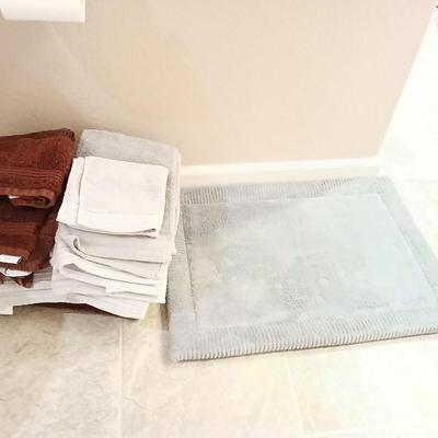 Grey and maroon towels with a better homes & garden memory foam bathmat