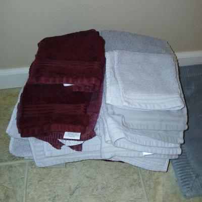Grey and maroon towels with a better homes & garden memory foam bathmat