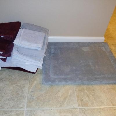Grey and maroon towels with a better homes & garden memory foam bathmat