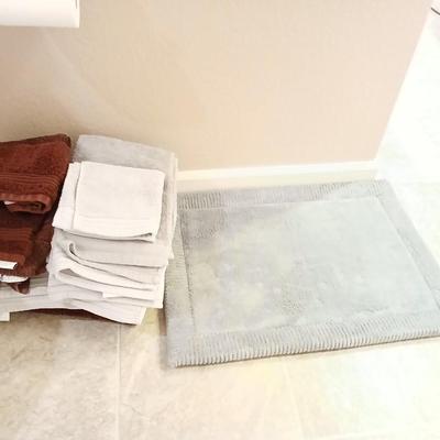 Grey and maroon towels with a better homes & garden memory foam bathmat